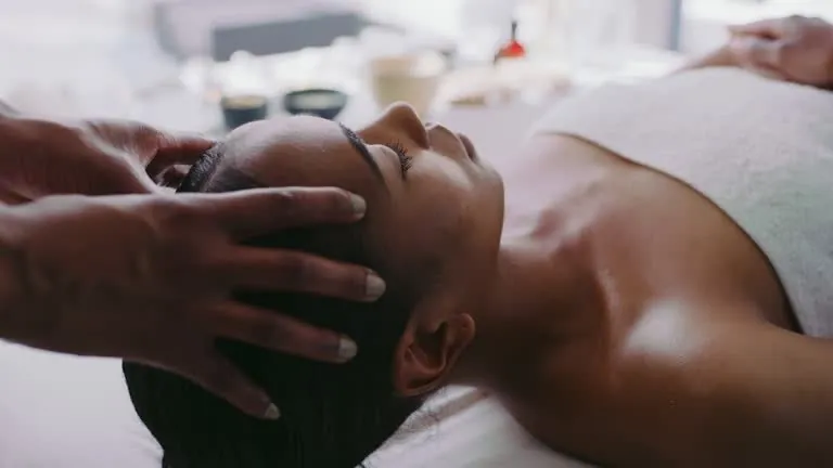 Male massage therapist providing Thai massage to female client in Johannesburg